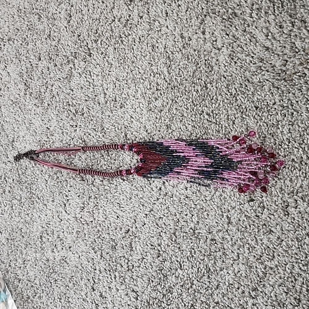 Handmade necklace purchased on a trip. Love the funkiness of it.